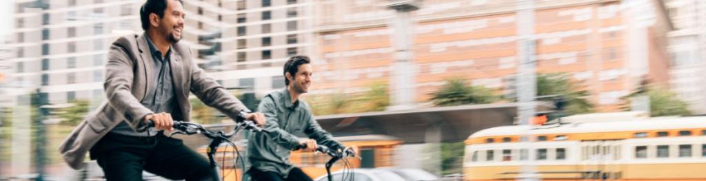 2 men riding bikes 