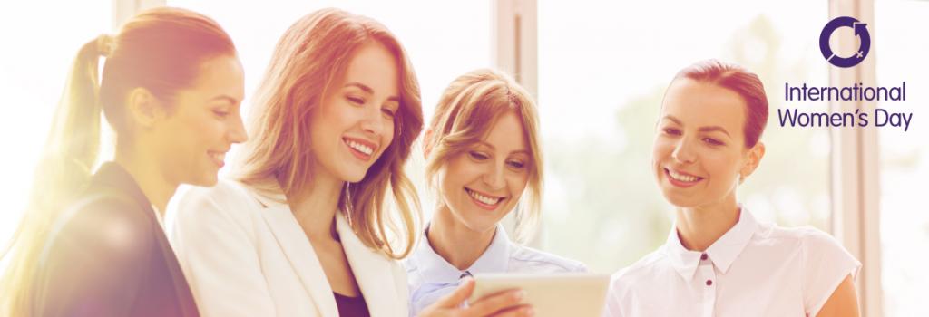 Females smiling for International Women's Day