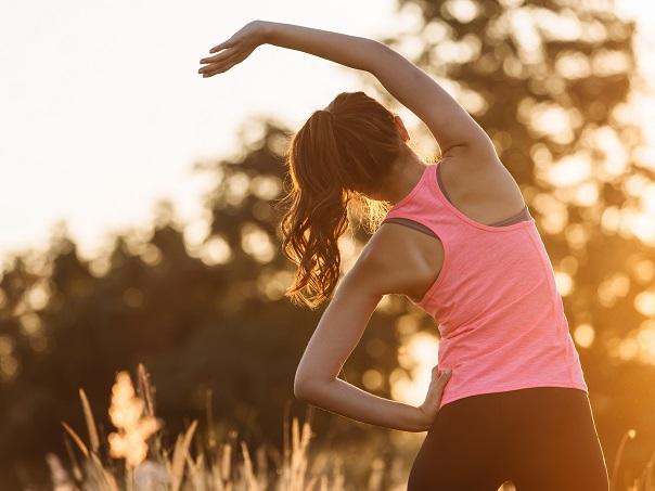 Female staying active and stretching while travelling