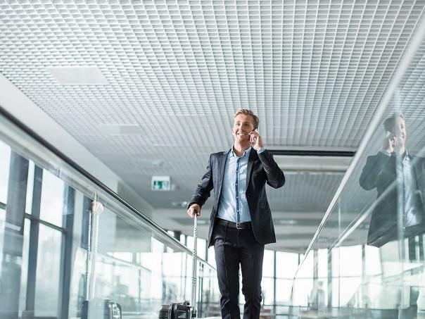 Male in airport on phone