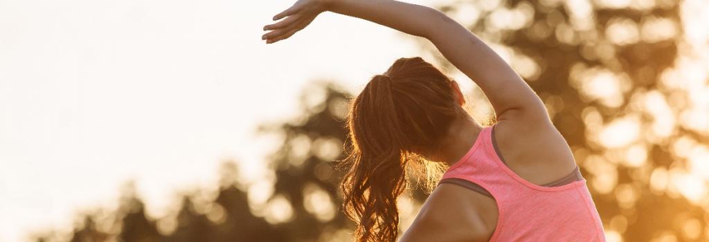 Female staying active and stretching while travelling