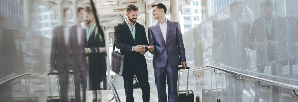 Men in airport travelling