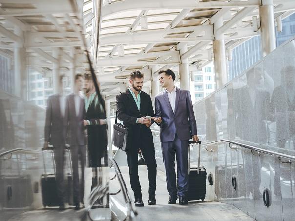 Men in airport travelling