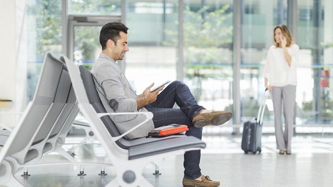 Male in airport waiting for flight