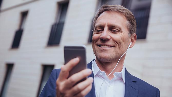 Male-professional-looking-at-phone